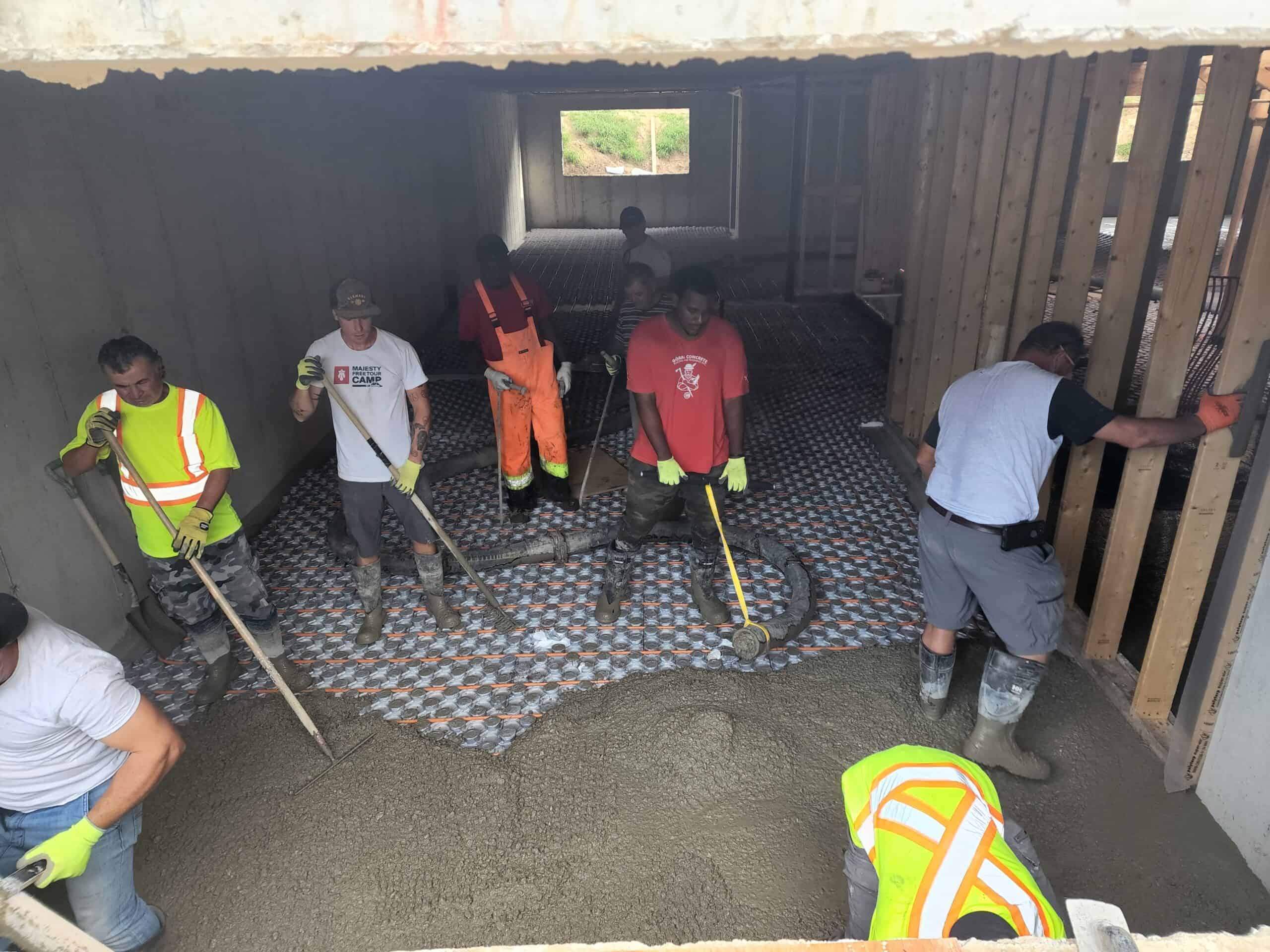 Concrete pumping for a basement slab pour